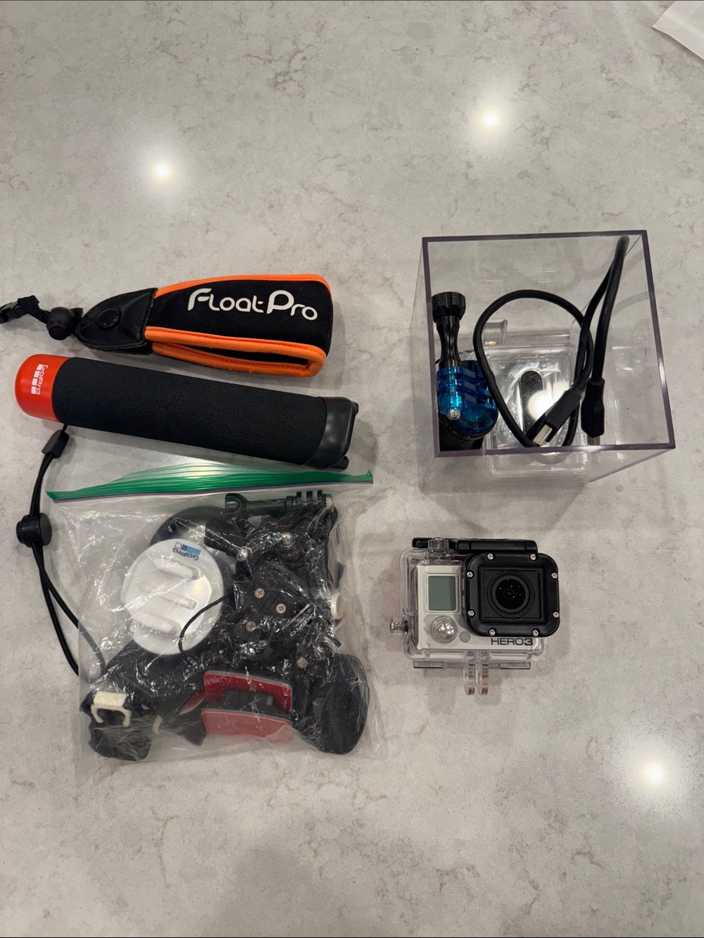 GoPro HERO3 Silver Action Camera with Orange and Black Float Pro Grip and Mounts